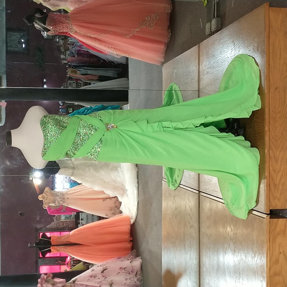 Strapless full beaded bodest with rouging strips of fabric crisscrossing connect